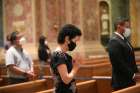 People pray during a 2020 Mass at the Cathedral of St. Matthew the Apostle in Washington. The Archdiocese of Washington filed a lawsuit Dec. 11, 2020, objecting to Mass attendance restrictions imposed by the District of Columbia as a measure to minimize the spread of COVID-19.