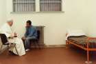 St. John Paul II sits with his would-be assassin, Mehmet Ali Agca, in Rome&#039;s Rebibbia prison in this 1983 photo. Mehmet Ali Agca laid a bunch of white roses at St. John Paul II&#039;s tomb exactly 31 years after the late Pope forgave him for shooting and trying to assassinate him.
