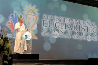 Cardinal Timothy M. Dolan of New York speaks in 2016 at a session of the 51st International Eucharistic Congress in Cebu, Philippines. Pope Francis, the Pontifical Committee for International Eucharistic Congresses and local organizers have agreed to postpone by one year the 52nd International Eucharistic Congress in Hungary, the Vatican announced April 23, 2020.