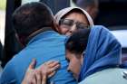 Afghan refugees at Dulles International Airport in Dulles, Va., embrace family members Sept. 2, 2021, before boarding buses that will take them to a processing center.