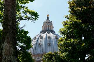 The dome of St. Peter&#039;s Basilica at the Vatican is framed by trees June 14. Abuse accusations against U.S. Archbishop Theodore E. McCarrick will be &quot;examined in a regular canonical trial,&quot; the Vatican press office announced July 28. Until then the former cardinal has been ordered to pray and do penance. 
