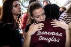 Students from Marjory Stoneman Douglas High School attend a memorial Feb. 15, 2018, following a school shooting in Parkland, Fla. Feb. 14 marks the first anniversary of the shooting that killed 14 students and three staff members at the school. 