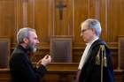 Msgr. Carlo Alberto Capella, left, a former Vatican diplomat who served in Washington, talks to his lawyer during his sentencing in a Vatican court June 23. Msgr. Capella was found guilty of possessing and distributing child pornography and sentenced to five years in a Vatican prison and fined 5,000 Euro. 