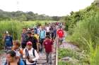 Migrants walk along a railroad track in Mexico on their journey toward the U.S. border.