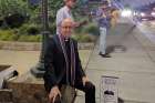  Catholic priest Fr. David Jenuwine plants himself in front of the entrance to BottleRock Napa in Napa, California, which was happening May 26-28. 