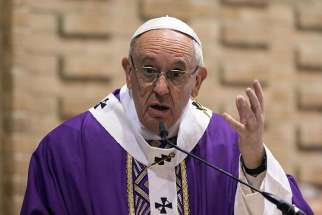 Pope Francis gestures as he celebrates Mass March 12 at the Rome parish of St. Magdalene of Canossa.