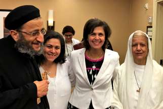 Mama Maggie, right, with some of her Canadian friends (from left): Fr. Angelos Saad of the Coptic Church, Christine Henein and Ghada Melek.