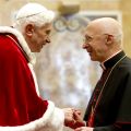 Pope Benedict XVI shakes the hand of Cardinal Angelo Bagnasco, president of the Italian bishops&#039; conference, during the pope&#039;s annual exchange of Christmas greetings in the Apostolic Palace at the Vatican Dec. 22. The pope said the &quot;faith fatigue&quot; seen i n various areas of church life contrasts sharply with the faith and joy he witnessed during World Youth Day in Madrid and during his November trip to Benin.