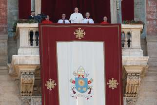 Pope Francis delivers his Christmas message and blessing &quot;urbi et orbi&quot; (to the city and the world) from the central balcony of St. Peter&#039;s Basilica at the Vatican Dec. 25. 