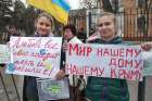 Ukrainian women hold peace placards near a military base in Ukraine&#039;s Crimea region in this March 4, 2014 file photo.