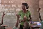 Masidalia Abduraman teaches a class April 30 in the Catholic school in Kauda, a village in the Nuba Mountains of Sudan. The area is controlled by the Sudan People&#039;s Liberation Movement-North, and frequently attacked by the military of Sudan. Catholic Church workers have accompanied people in the region, experiencing the same challenges as the people they serve.