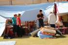 People displaced by violence stand outside their tent at St. Joseph Chaldean Catholic Church in Ankawa, Iraq, Aug. 14. A typical day for many Iraqi Christians encamped at Ankawa, near Irbil, would probably involve another round of struggle against despe ration, frustration, anxiety, boredom and fear.