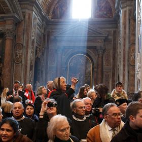 Sunlight streams onto pilgrims in St. Peter&#039;s Basilica after a consistory led by Pope Benedict XVI at the Vatican Feb. 18. The pope created 22 new cardinals from 13 countries -- including two from the United States and one from Canada.