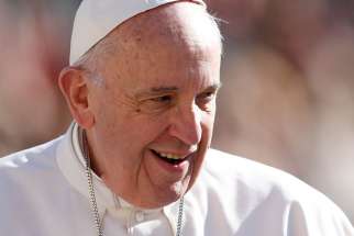 Pope Francis smiles as he greets the crowd during his general audience in St. Peter&#039;s Square at the Vatican March 1.