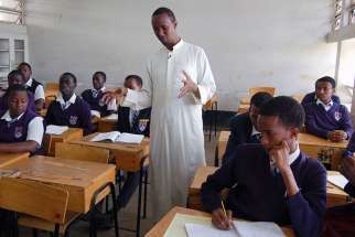 Ayub Mohamud, center, teaches a religious education class at Eastleigh High School in Nairobi, Kenya, on March 2, 2016. Mohamud is the Muslim spiritual affairs patron, but Eastleigh High does not employ a chaplain.