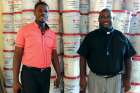 Caritas co-ordinators with hygiene kits for hurricane victims in Haiti.