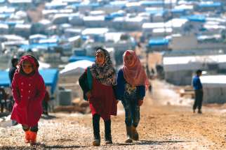 Internally displaced Syrian children walk together at a camp near the Turkish border in Atmeh, Syria. Syrian refugees have been the greatest recipient of Canada’s refugee program in the last five years, with two-thirds ending up in the privately-sponsored refugee program.