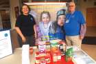 Wanda and Bernie Hartlin with the North of 60 display at Holy Redeemer parish in Ottawa showing the items needed to fill the sea container.