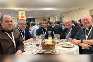 Frs. Pierre Ducharme, OFM., Daniel Ouellet, Fabio de Souza and Raymond Lafontaine all helped to orchestrate the Canadian National Online Gathering for Priests video conference  on Aug. 14. Pictured are them with lay theologian Gilles Routhier (second from right) at the Vatican&#039;s Parish Priests of the Synod Meeting from April 28-May 2.