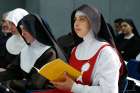 A nun holds a copy of &quot;Cor Orans,&quot; a new instruction for contemplative women religious, during a news conference for its release at the Vatican May 15. The instruction concerns the life, autonomy, supervision and formation of contemplative women religious. 