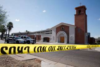 Police tape and vehicles are seen outside Mater Misericordiae (Mother of Mercy) Mission in Phoenix the morning after a priest was killed and another critically injured during an attack at the mission the night of June 11. Sgt. Steve Martos of the Phoenix Police Department said police received a 911 call at about 9 p.m. reporting a burglary.