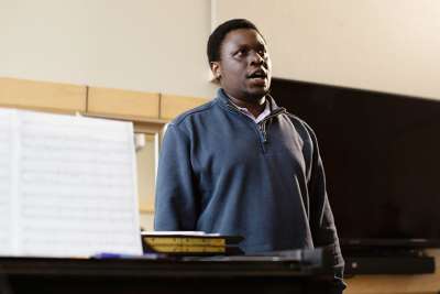 The life of Eddie Baraka Mony, pictured, changed through the support of Mirijam and Stuart Spoelstra who sponsored Mony through Chalice to allow him to pursue his dream of becoming an opera singer.