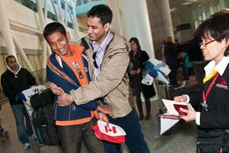 Scenes such as these of refugees arriving at Toronto’s Pearson Airport have disappeared as COVID-19 took hold. Plans to take in 1.2 million immigrants by 2023 has refugee sponsors wondering how that number can be achieved with travel restrictions brought on by COVID-19.