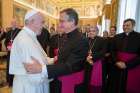 Pope Francis greets Msgr. Dario Vigano, director of the Vatican Secretariat for Communications, during a meeting with members of the secretariat at the Vatican May 4. Addressing the group responsible for reforming Vatican communications, the pope said that courageous teamwork is needed to best respond to new challenges.