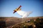 A plane drops fire retardant during a wildfire near Nataf, Israel, Nov. 26.