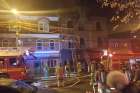 Firefighters attend to the scene at Chantecler restaurant in Toronto’s Parkdale neighbourhood, next to St. Francis Table.