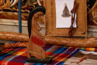 A wooden statue of a pregnant woman is pictured in the Church of St. Mary in Traspontina as part of exhibits on the Amazon region during the Synod of Bishops for the Amazon in Rome Oct. 18, 2019. Several copies of the statue were stolen from the church and thrown into the Tiber River Oct. 21.