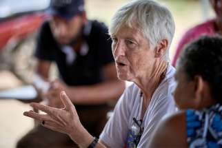 U.S. Sister Kathryn &quot;Katy&quot; Webster, a member of the Sisters of Notre Dame de Namur from the United States, talks with farmers in the countryside near Anapu, in Brazil&#039;s northern Para state.