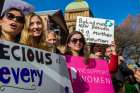 Pro-life supporters gather while holding signs outside the New South Wales Parliament House in Sydney Aug. 1, 2019.