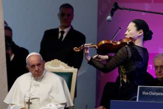  Pope Francis watches as violinist Midori performs at a meeting of the governing council of the International Fund for Agricultural Development at the headquarters of the U.N. Food and Agriculture Organization in Rome Feb. 14, 2019. 