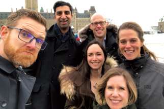 Sara Francis, centre, joins her fellow CCO alumni for a wintery walk around Ottawa. 