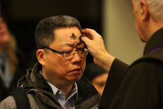 A man receives ashes on Ash Wednesday at St. Francis of Assisi Church in New York in 2014. 