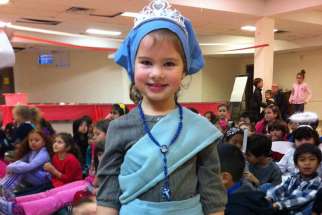 A young parishioner dresses as St. Elizabeth of Hungary for St. Joseph the Worker parish’s All Saints’ Day festivities.
