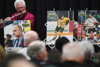 A musician performs during an April 8 vigil at Elgar Petersen Arena in Humboldt, Saskatchewan, to honour members of the Humboldt Broncos junior hockey team who were killed in a bus accident. 