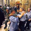 Israeli police officers scuffle with a member of the Armenian clergy in the Church of the Holy Sepulchre in Jerusalem in 2008. Ancient animosities are not uncommon in Jerusalem, even at holy sites.
