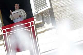 Pope Francis leads the Angelus from the window of his studio overlooking St. Peter&#039;s Square at the Vatican Aug. 30.