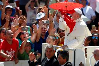  Pope Francis greets pilgrims as he arrives in St. Peter&#039;s Square at the Vatican Aug. 12, after an outdoor Mass celebrated by Cardinal Gualtiero Bassetti of Perugia-Citta della Pieve, president of the Italian bishops&#039; conference. 