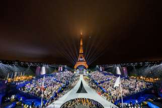 The Trocadero venue is seen, with the Eiffel Tower looming in the background, as the Olympic flag is raised July 26, during the opening ceremony of the Paris 2024 Olympic Games.