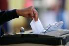  A voter casts his ballot May 25 in Dublin as Ireland holds a referendum on its law on abortion. Voters opted by a margin of 66.4 percent to 33.6 percent to remove the right to life of the unborn from the constitution.