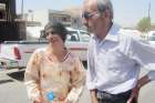 Ayda and Khider Abada discuss with residents of Ankawa, Iraq, Aug. 28 how their daughter was kidnapped by Islamic State militants in Qaraqosh. Ayda Abada said when she followed her daughter off the bus the terrorists pointed guns at her face and told her to get back on the bus or they would kill her. 