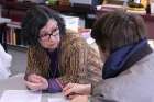 Claudia Raffaele is seen with a student at Jesuit High School in Portland Feb. 2.