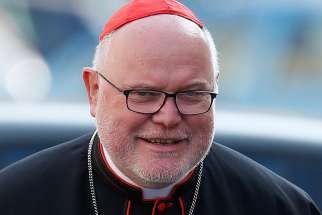 Cardinal Reinhard Marx of Munich and Freising, Germany, arrives for the morning session of the extraordinary Synod of Bishops on the family at the Vatican 2014.