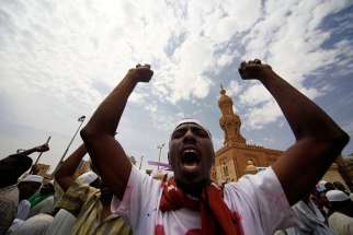 Sudanese demonstrators leave a Khartoum mosque after Friday prayers in this picture dated Sept. 14. Sudanese Christians have condemned the sentencing of a Christian woman to death by hanging after she married a Christian man.