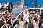 Pope Francis greets the crowd before celebrating Mass at Monza Park near Milan March 25.