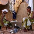 Twins Hawa and Adama Keita, 15, warm a pot of tea in late November outside an area where 15 other family members rent rooms in a suburb of Bamako, Mali. More than 200,000 Malians have migrated to the south since a March 2012 military coup, while a simila r number have fled to Niger, Burkina Faso, Morocco and Algeria.