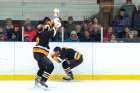 Fr. John Perdue launches a surprise at a teammate and an unsuspecting audience during a charity game in Mattawa, Ont.